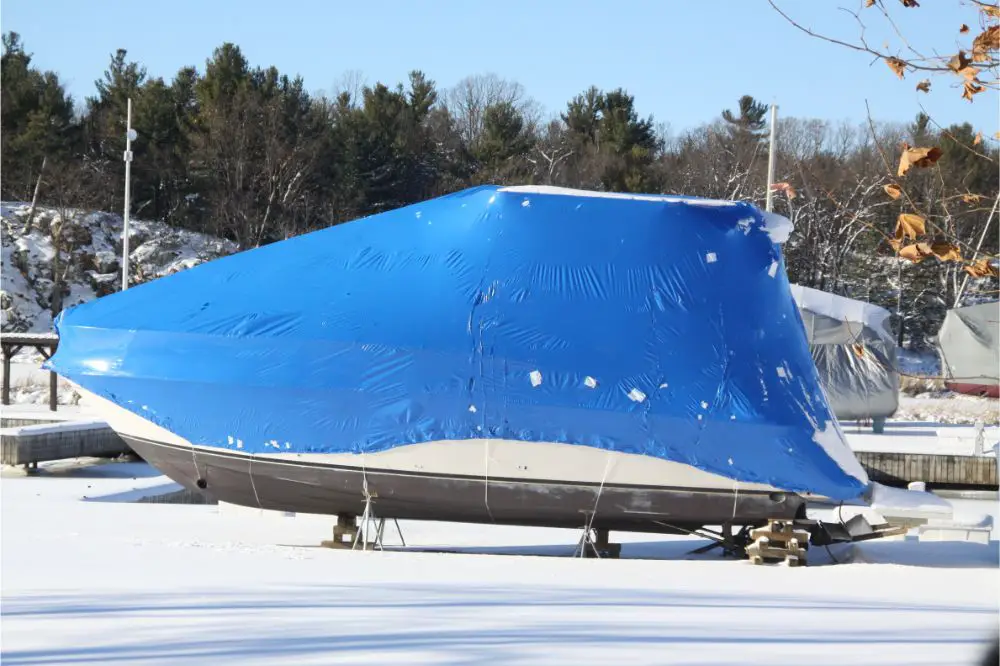 Plastic shrink wrap on boat, to protect boat and interior of boat from the winter elements
